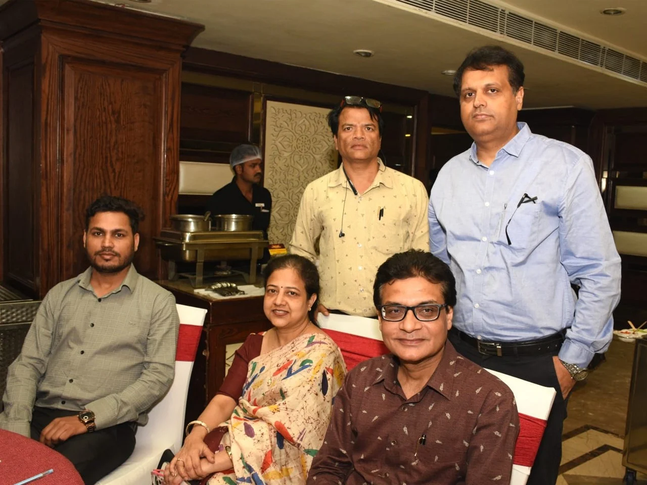 Lab technician processing medical samples at Dr. Sudeep's Pathology and Biopsy Centre.