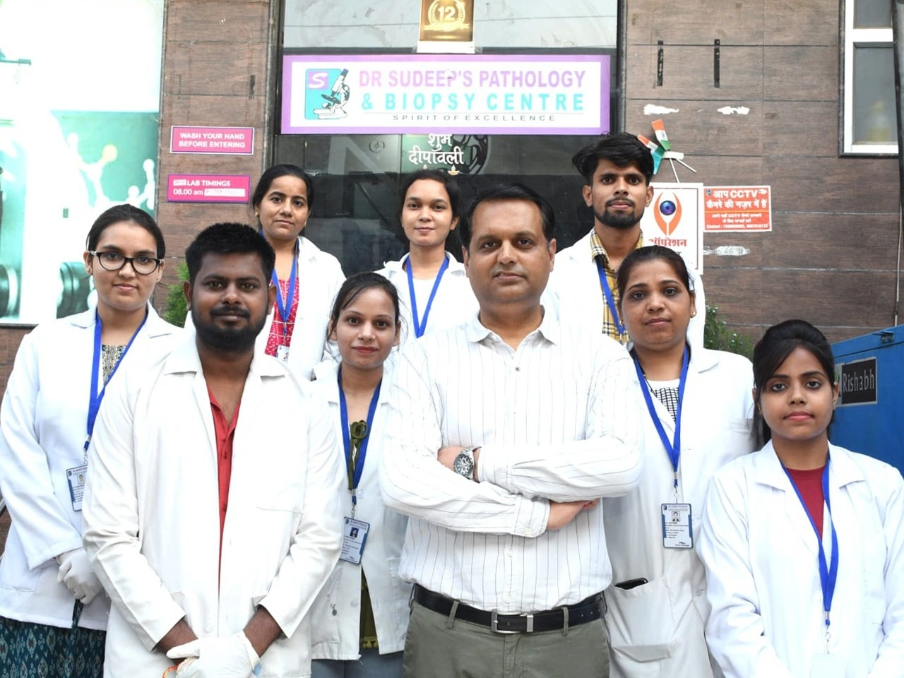 Dr. Sudeep Thakur, MD Pathology, examining clinical biopsy reports in his office.