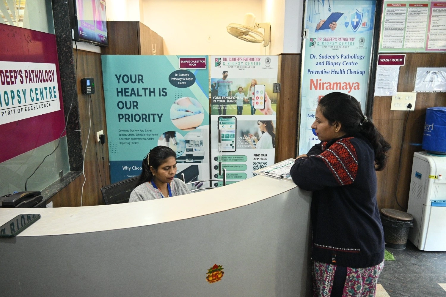 Patient reception and help desk at Dr. Sudeep’s Pathology Centre for health checkup inquiries.