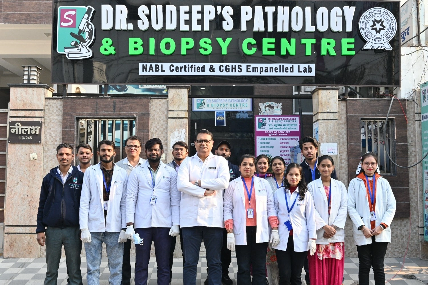Professional medical team and laboratory staff outside Dr. Sudeep’s Pathology and Biopsy Centre.
